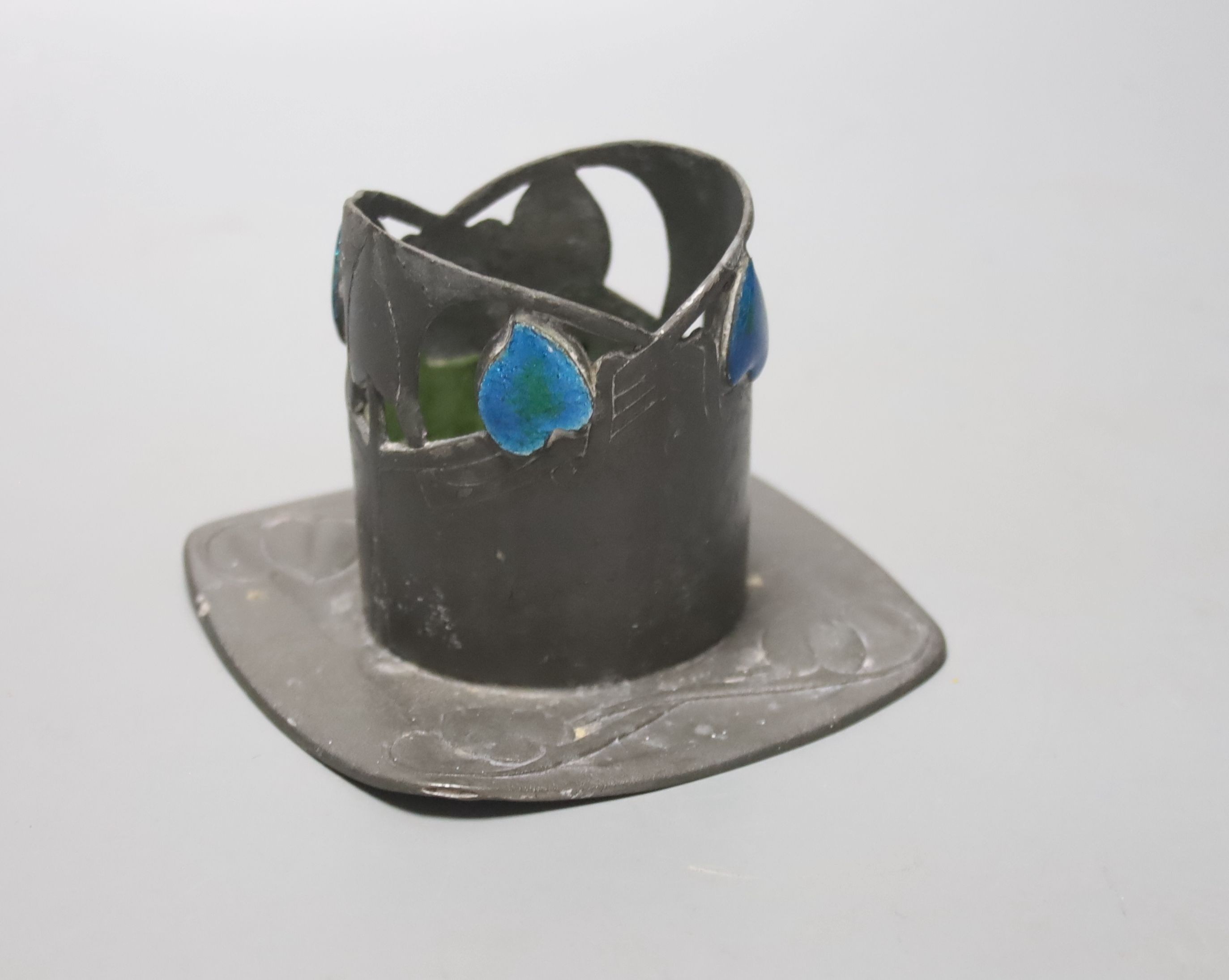 A Libertys Tudric enamelled pewter stand, H7cm, remnants of glass